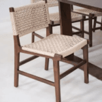 Kursi cafe kayu jati minimalis dengan sandaran rotan alami dan jok kain abu-abu produksi Karya Mebel Jepara